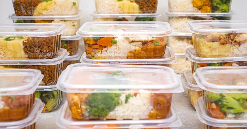 Multiple containers of prepared meals with rice and vegetables for easy meal management.