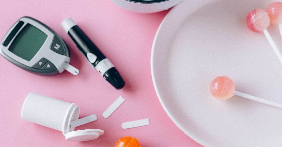 Contrasting health choices with Brussels sprouts and lollipops on a pink background.