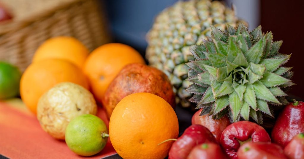 A vibrant assortment of fresh, organic fruits including oranges, pineapple, and apples, perfect for a healthy diet.
